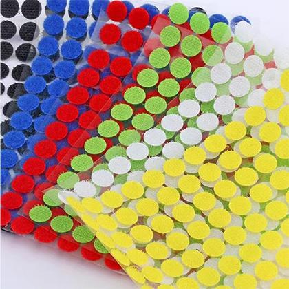 Adhesive backing hook and loop coins